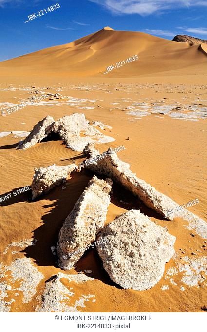 Surface of a salt and clay pan and sand dunes at Erg Mehedjibat, Immidir, Algeria, Sahara, North Africa