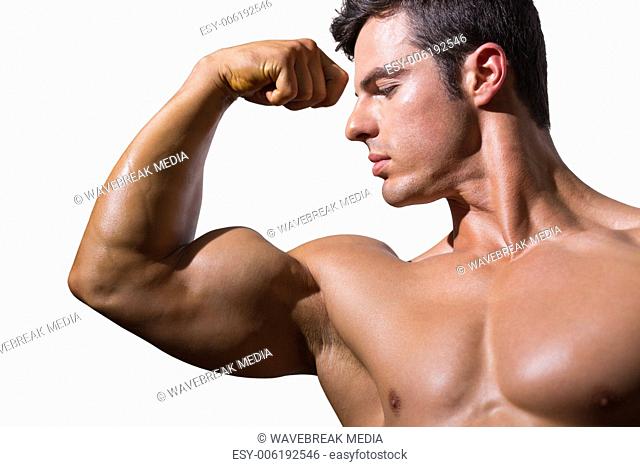 Close-up of a shirtless muscular man flexing muscles