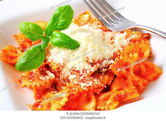 Bow-tie pasta with tomato sauce and parmesan
