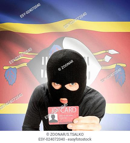 Hacker with flag on background holding ID card in hand - Swaziland