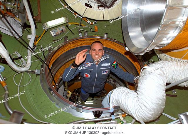 South African space flight participant Mark Shuttleworth enters the functional cargo block's (FGB) pressurized adapter on the International Space Station (ISS)