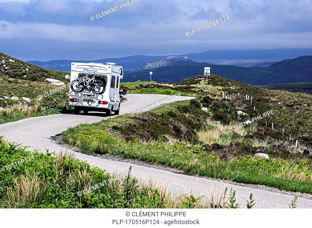 Motorhome at passing place on winding single track road in the Scottish Highlands, Scotland, UK