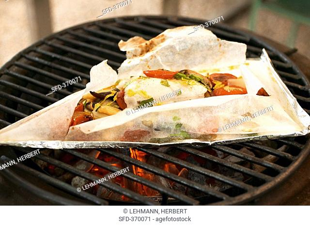 Turbot and vegetables grilled in parchment paper