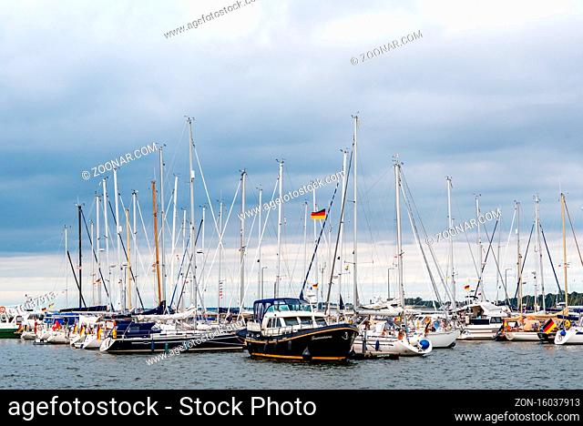 Stralsund, Germany - July 31, 2019: Yachts and sailingboats moored in the pier of the harbour. Stralsund old town is a UNESCO World Heritage site