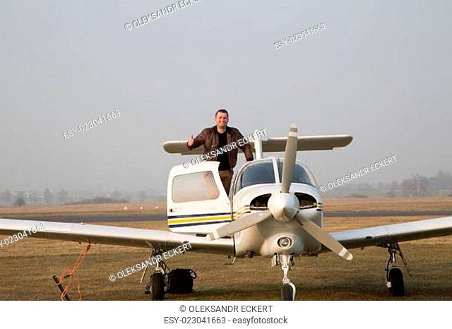 Pilot with the aircraft after landing