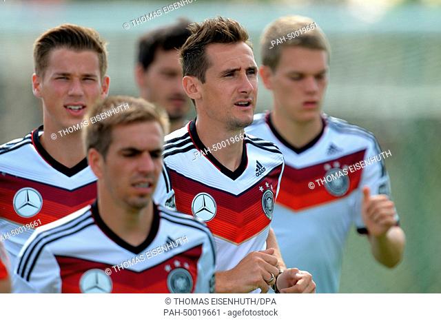 Erik Durm (L-R), Philipp Lahm, Miroslav Klose, Matthias Ginter warm up during a training session of the German national soccer team at the training center in...