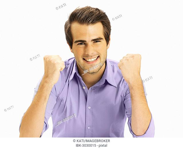 Businessman clenching fists, happy, optimistic