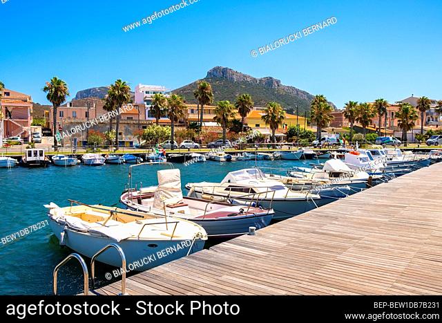 Golfo Aranci, Sardinia / Italy - 2019/07/16: Panoramic view of Golfo Aranci yacht port - Marina di Golfo Aranci - with seashore park boulevard at the Tyrrhenian...
