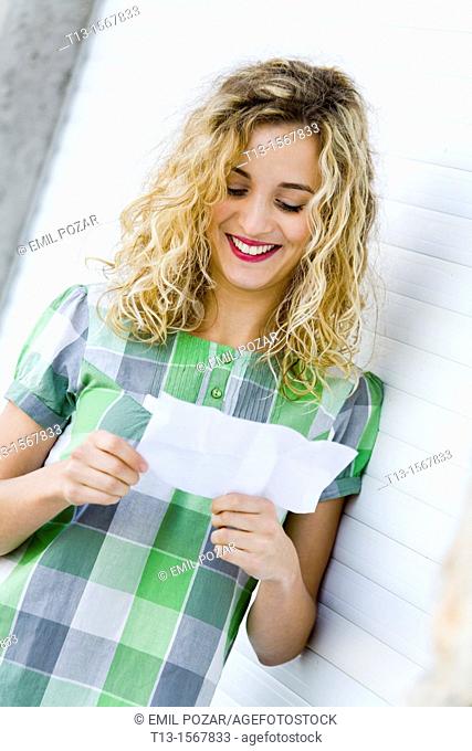 Reading paper note student girl