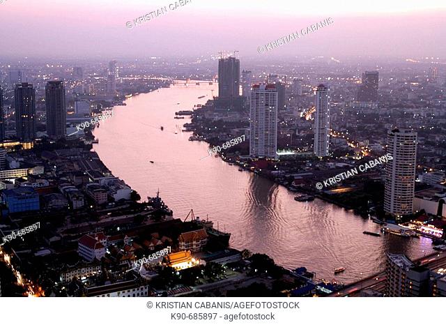 Residential buildings close to the Chao Phraya River in downtown Bangkok, the City of Angels, at dusk, Thailand, Southeast Asia