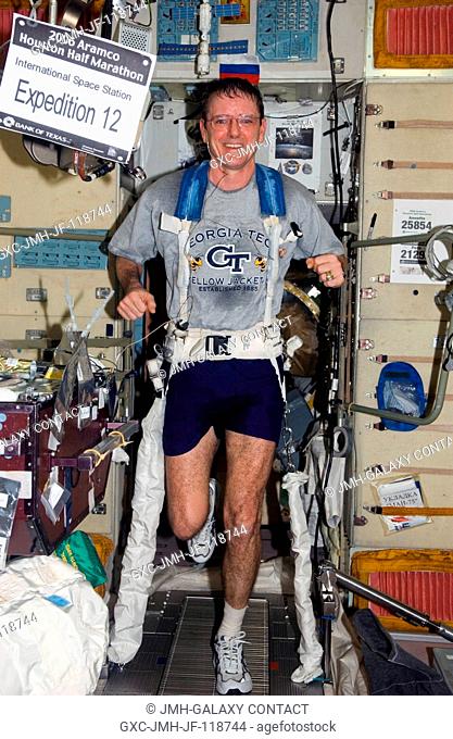 Astronaut William S. (Bill) McArthur, Jr., Expedition 12 commander and NASA space station science officer, exercises on the Treadmill Vibration Isolation System...