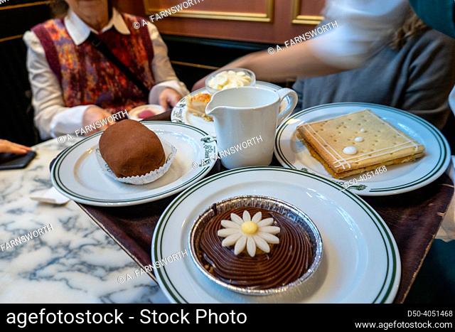 Copenhagen, Denmark People being served coffee and cake at La Glace, a landmark patisserie