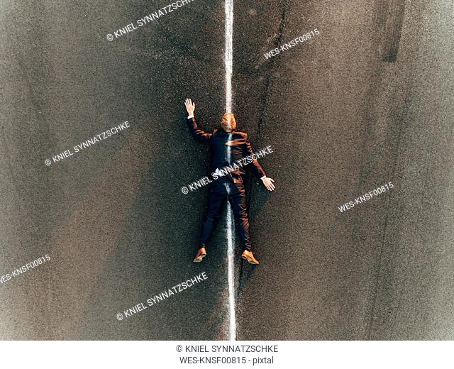 Run over man lying on road