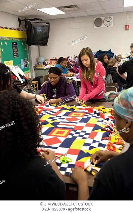 Ecorse, Michigan - Members of Americorps and other volunteers make blankets for the homeless as part of a community service project on the Martin Luther King...