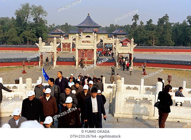 Tourist groups sightseeing at the Temple of Heaven Tiantan, Beijing, China