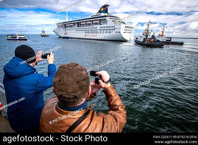 11 April 2022, Mecklenburg-Western Pomerania, Wismar: The cruise ship ""Superstar Libra"", which was last used as a residential ship for external shipyard...