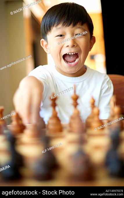 Japanese kid playing chess