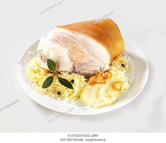 Eisbein cured knuckle of pork with sauerkraut and mashed potato