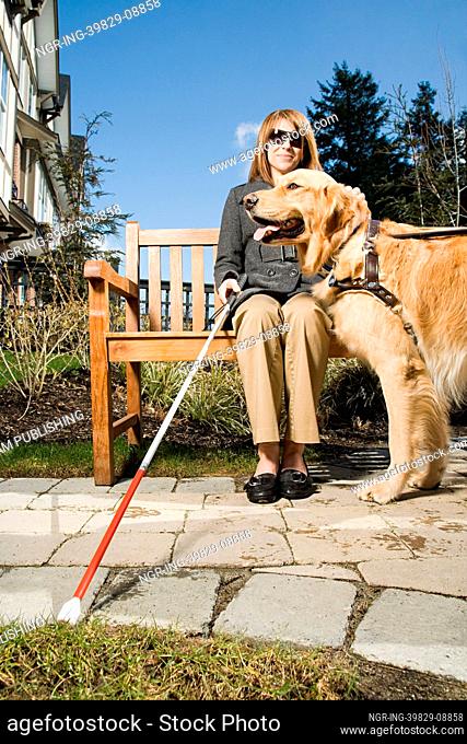 Blind woman with a guide dog