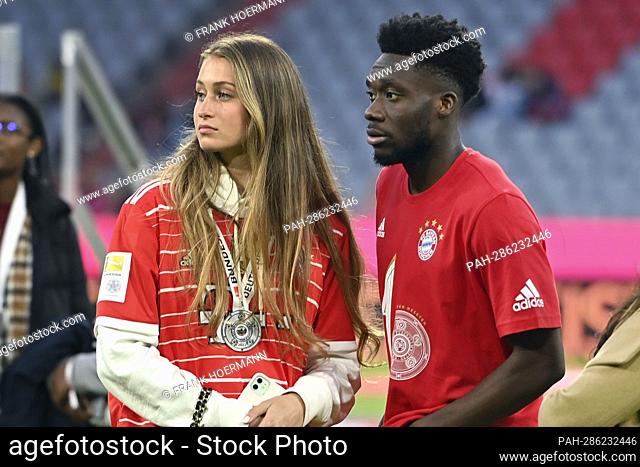 Alphonso DAVIES (FC Bayern Munich) with girlfriend Jordyn HUITEMA after award ceremony, football 1. Bundesliga season 2021/2022, matchday 33, matchday33