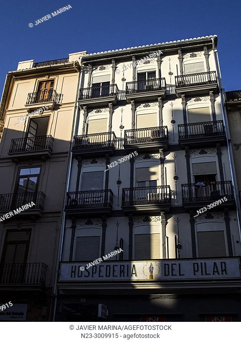 Shadows of buildings projected on the Hospederia del Pilar (El Pilar inn), Valencia, Spain