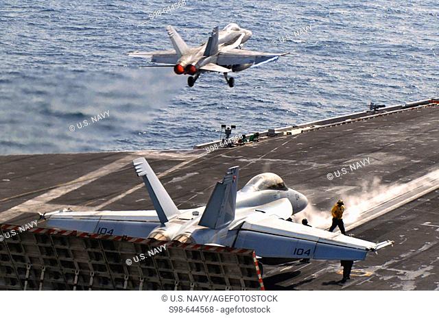 ARABIAN GULF (March 28, 2007) - An F/A-18C Hornet, assigned to the 'Blue Diamonds' of Strike Fighter Squadron (VFA) 146, launches from the flight deck as an...