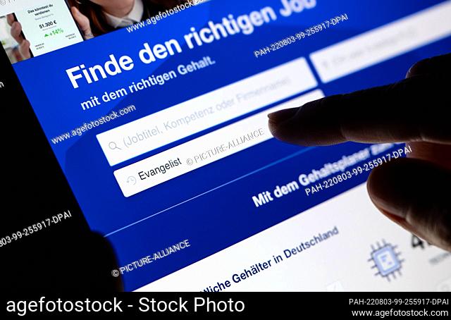 03 August 2022, Bavaria, Munich: ILLUSTRATION - A woman searches for job ads under the job title ""evangelist"" on the Stepstone job portal on her tablet
