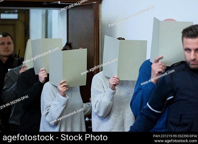 PRODUCTION - 19 December 2023, North Rhine-Westphalia, Dortmund: The five accused police officers enter the courtroom of the district court