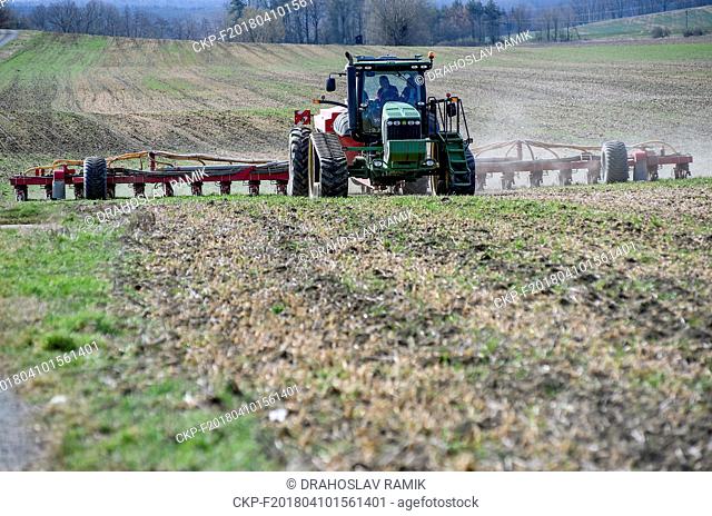 Sowing of sunflowers (Helianthus) by John Deere 8345 RT tractor with Horsch Maestro (Maistro) 24 SW seed drill in Librantice, Czech Republic, on April 10, 2018