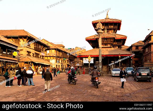Bhaktapur, Nepal - December 04, 2014: A busy market square with a tmeple in the city center
