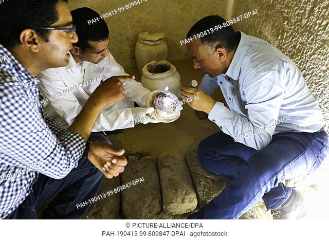 13 April 2019, Egypt, Giza: Secretary General of the Supreme Council of the Egyptian Antiquities Mustafa Wazir (R) and Head of the Egyptian archaeological...