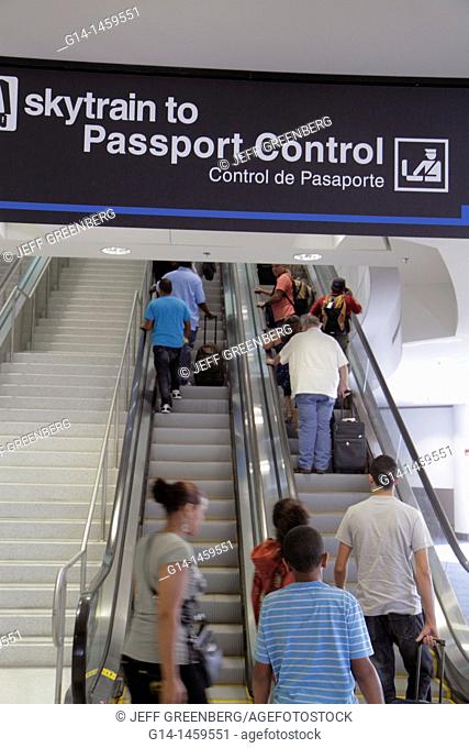 Florida, Miami, Miami International Airport, MIA, arriving passengers, international flight, concourse, passport control, skytrain, escalator