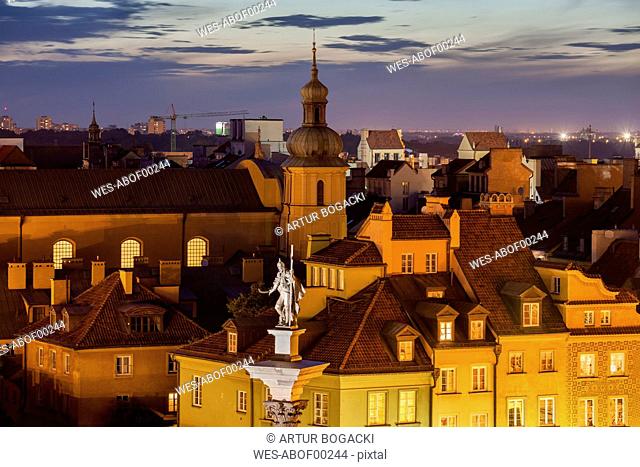 Poland, Warsaw, Old Town at dusk, historic houses rooftops, King Sigismund III Vasa statue