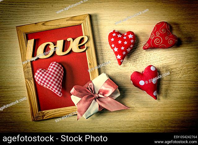 Card Valentine's Day. Mothers Day, March 8. Red frame, gift box and hearts. Copy space, flat lay