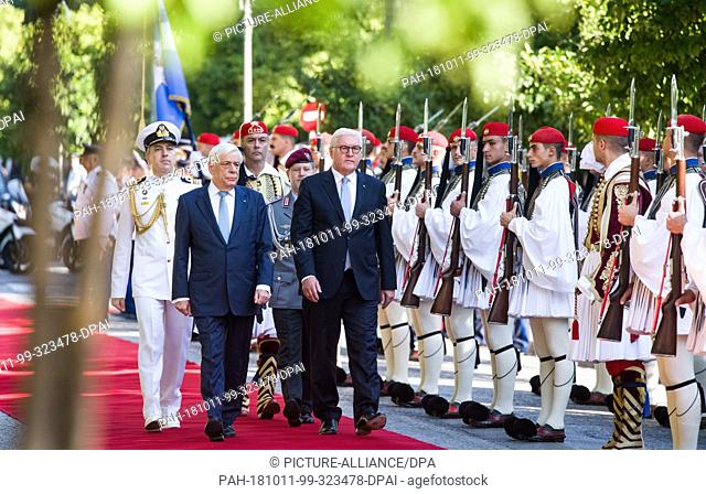 11 October 2018, Greece, Athens: President Frank-Walter Steinmeier (r) is greeted with military honours by Prokopis Pavlopoulos, President of Greece