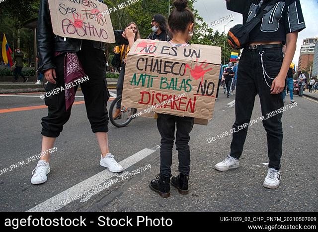 Women and a small kid participates with posters and signs against killings by police during demonstrations in Bogota, Colombia on May 7 2021 after peaceful...