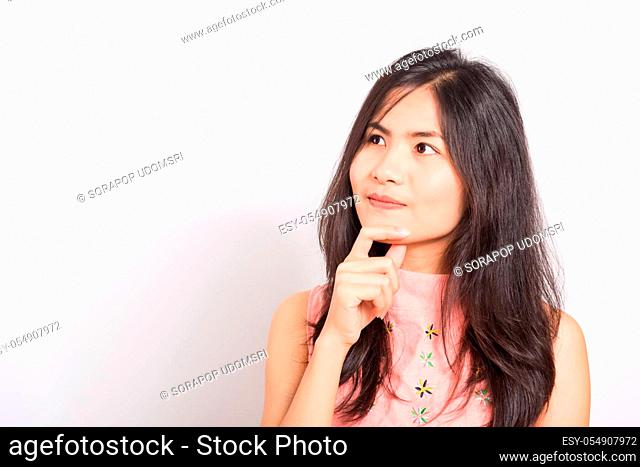 Portrait Asian beautiful young woman standing, She thinking or dreaming and looking up above, shoot photo in studio on white background