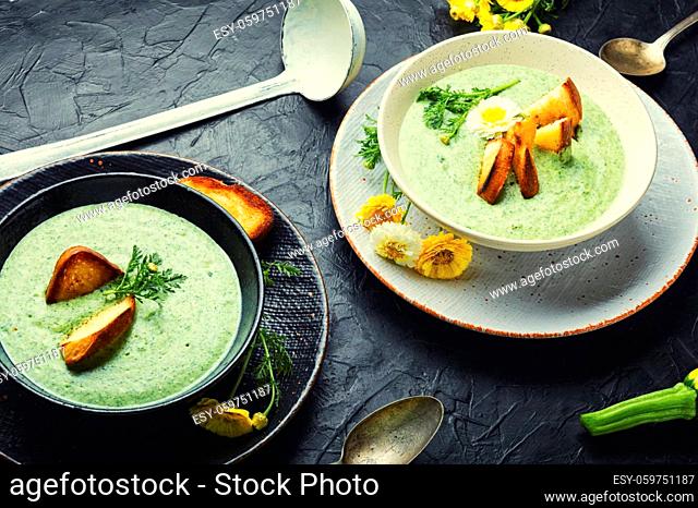 Puree soup, dietary zucchini and herb soup, garnished with croutons.Summer soup