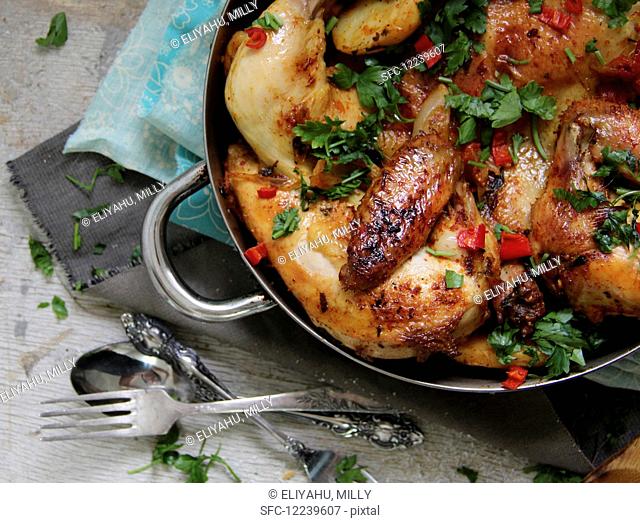 Chicken with fresh herbs and chilli (seen from above)