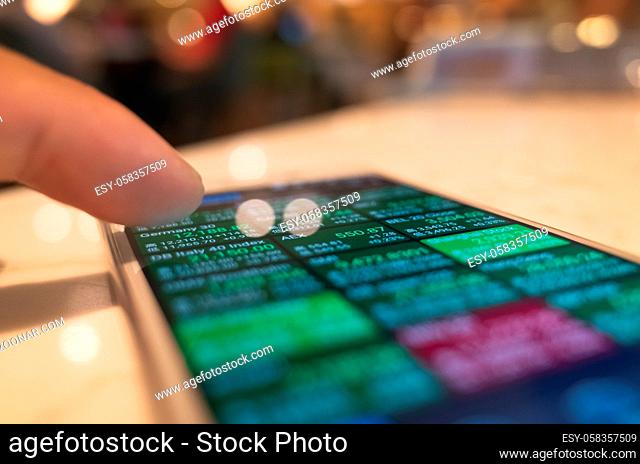 using a mobile device to check market data with bokeh copyspace