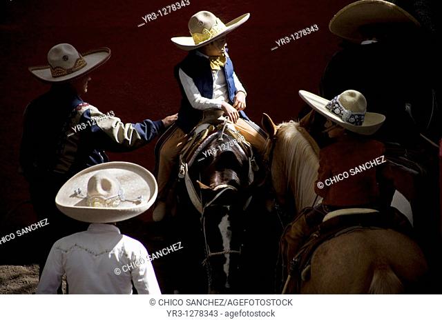 Mexican charros visit at the National Charro Championship in Pachuca, Hidalgo State, Mexico. Escaramuzas are similar to US rodeos