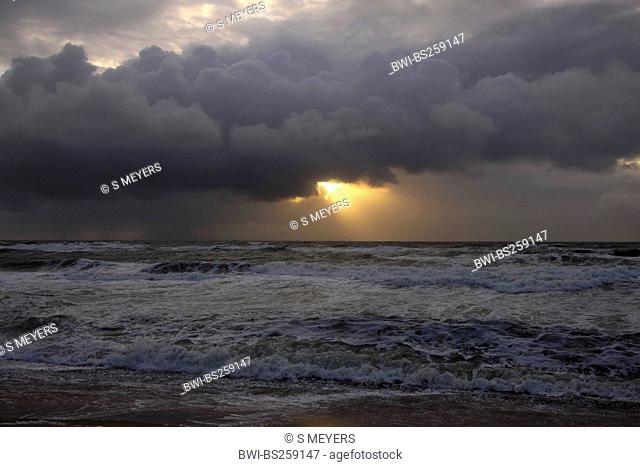 sun beam breaking through rain clouds over the North Sea, Germany, Sylt, Rantum