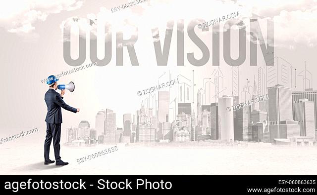 Young businessman with hard hat and OUR VISION inscription, new business opportunity concept