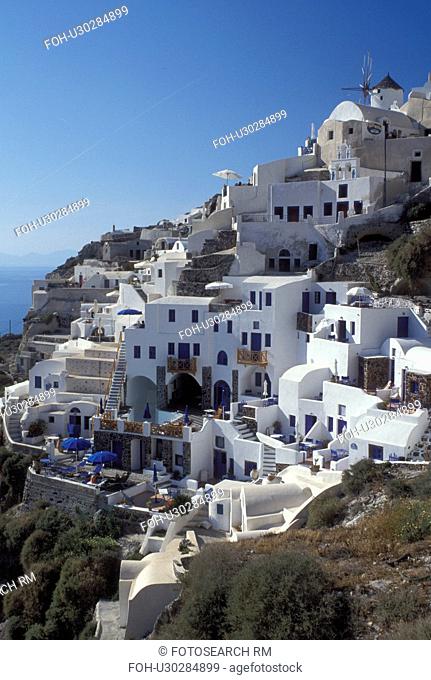 Santorini, Greece, Greek Islands, Oia, Cyclades, Europe, Resorts in the village of Oia on the steep hillside of Santorini Island on the Aegean Sea