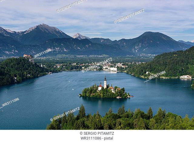 A view from above of Lake Bled and the Assumption of Mary Pilgrimage Church, Bled, Slovenia, Europe