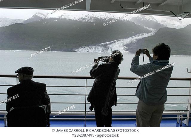 Cruise ship photographers taking pictures of Smith Glacier in College Fjord, Alaska, USA