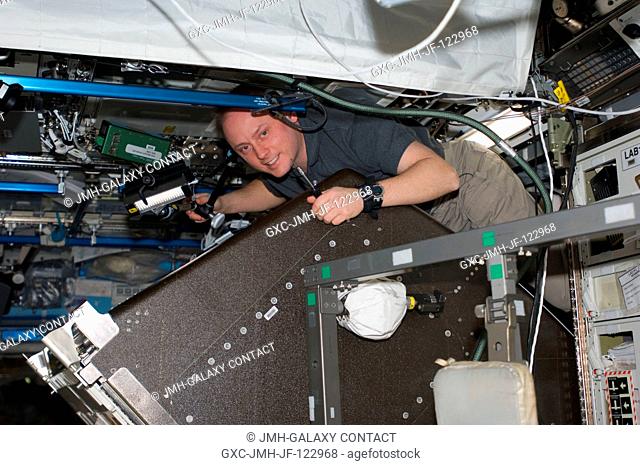 Astronaut Michael Fincke, Expedition 18 commander, performs a leak check on the Water Recovery System (WRS) in the Destiny laboratory of the International Space...