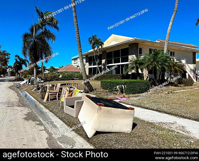 HANDOUT - 30 September 2022, US, Naples: Household goods lie in front of Sheri Naegele's vacation home on posh Gulf Shore Boulevard