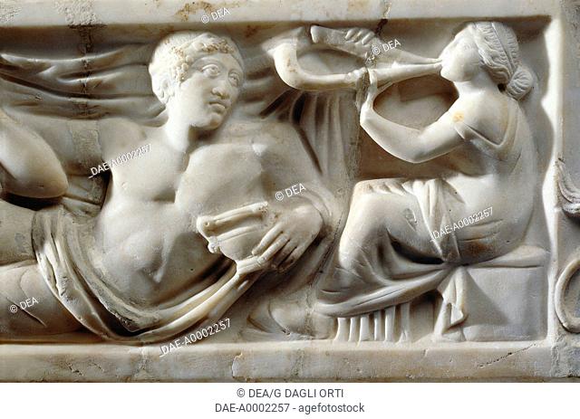 Roman civilization, 2nd century A.D. Marble sarcophagus with relief depicting the legend of Triptolemus. Detail: musician at a banquet