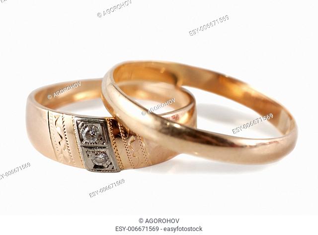 A pair of wedding rings (male and female) isolated over white background